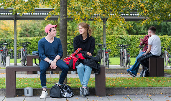 Students talking on the benches outside ϲ, Edinburgh