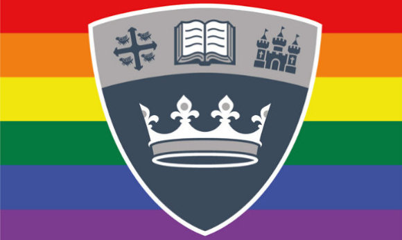 The ϲ shield in front of the LGBTQ+ flag