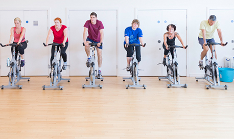 A busy spin class in session in the ϲ sports centre